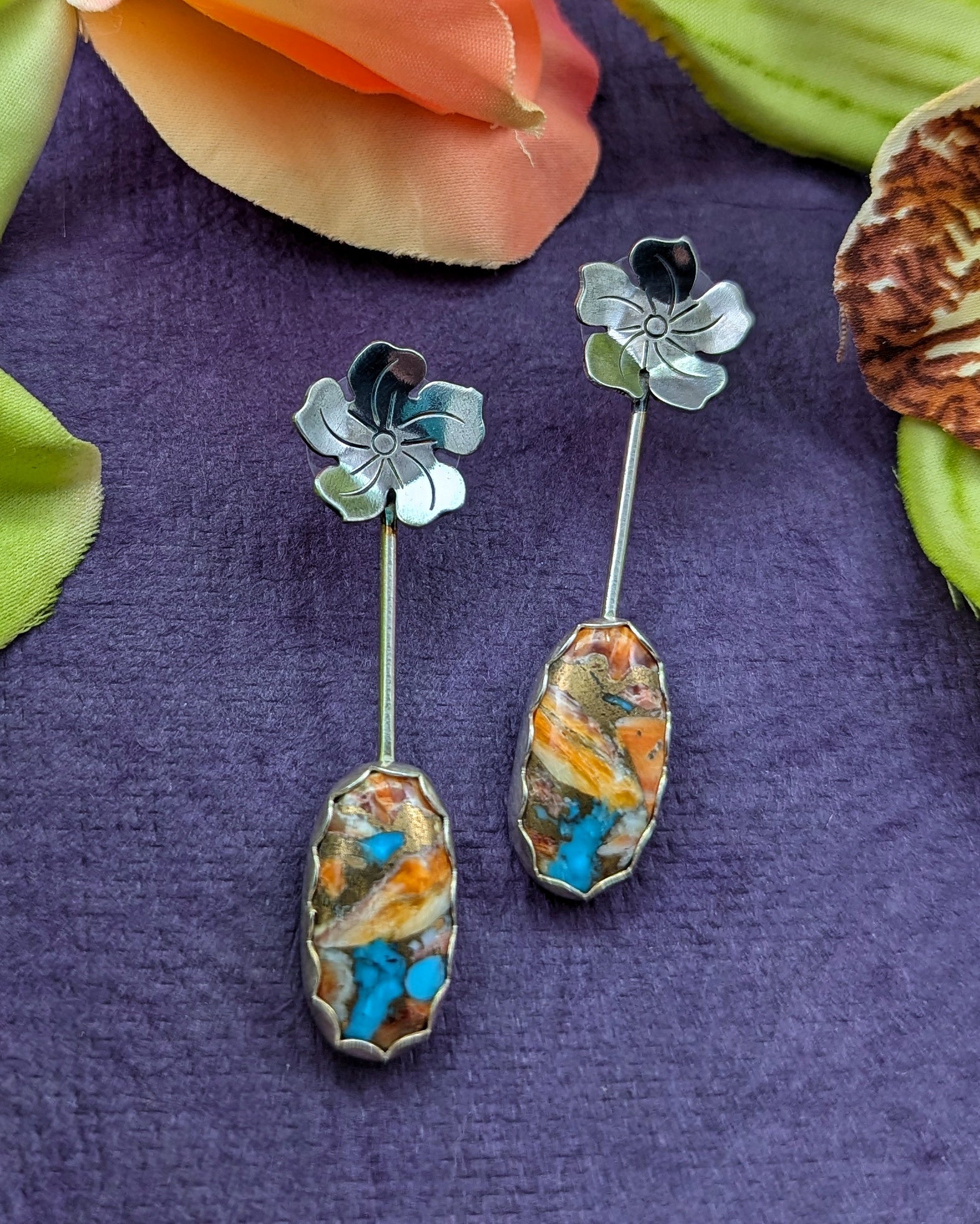 American mosaic turquoise flower earrings on a purple background