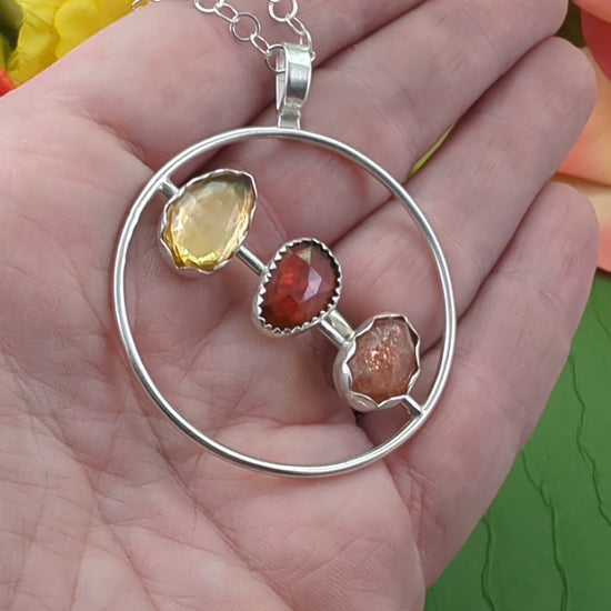 Video of the citrine, garnet and sunstone sterling silver circle necklace