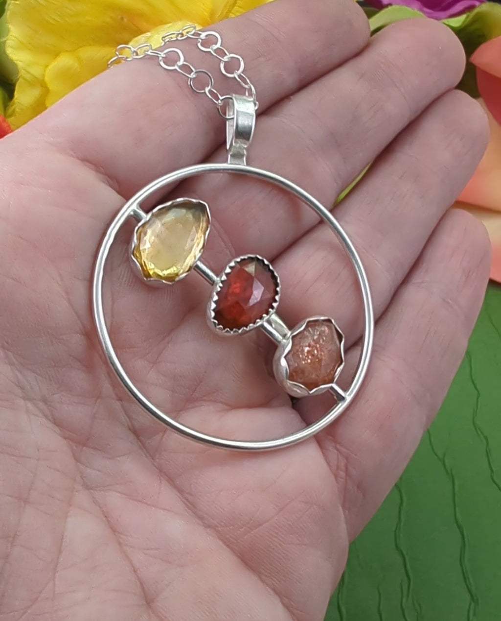 Video of the citrine, garnet and sunstone sterling silver circle necklace