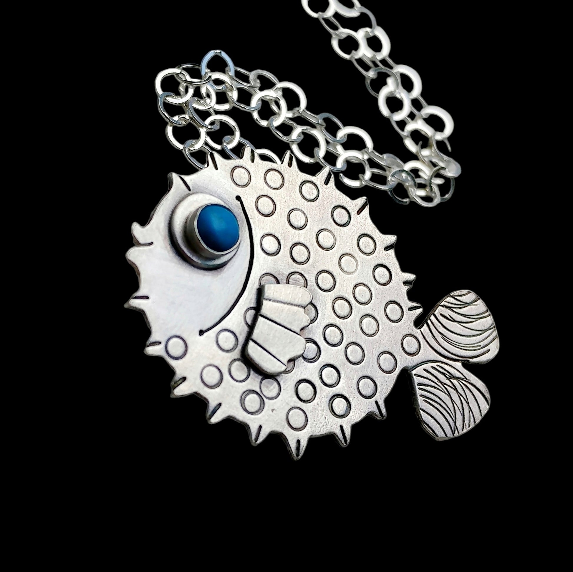 Sterling silver puffer fish necklace with blue howlite eye