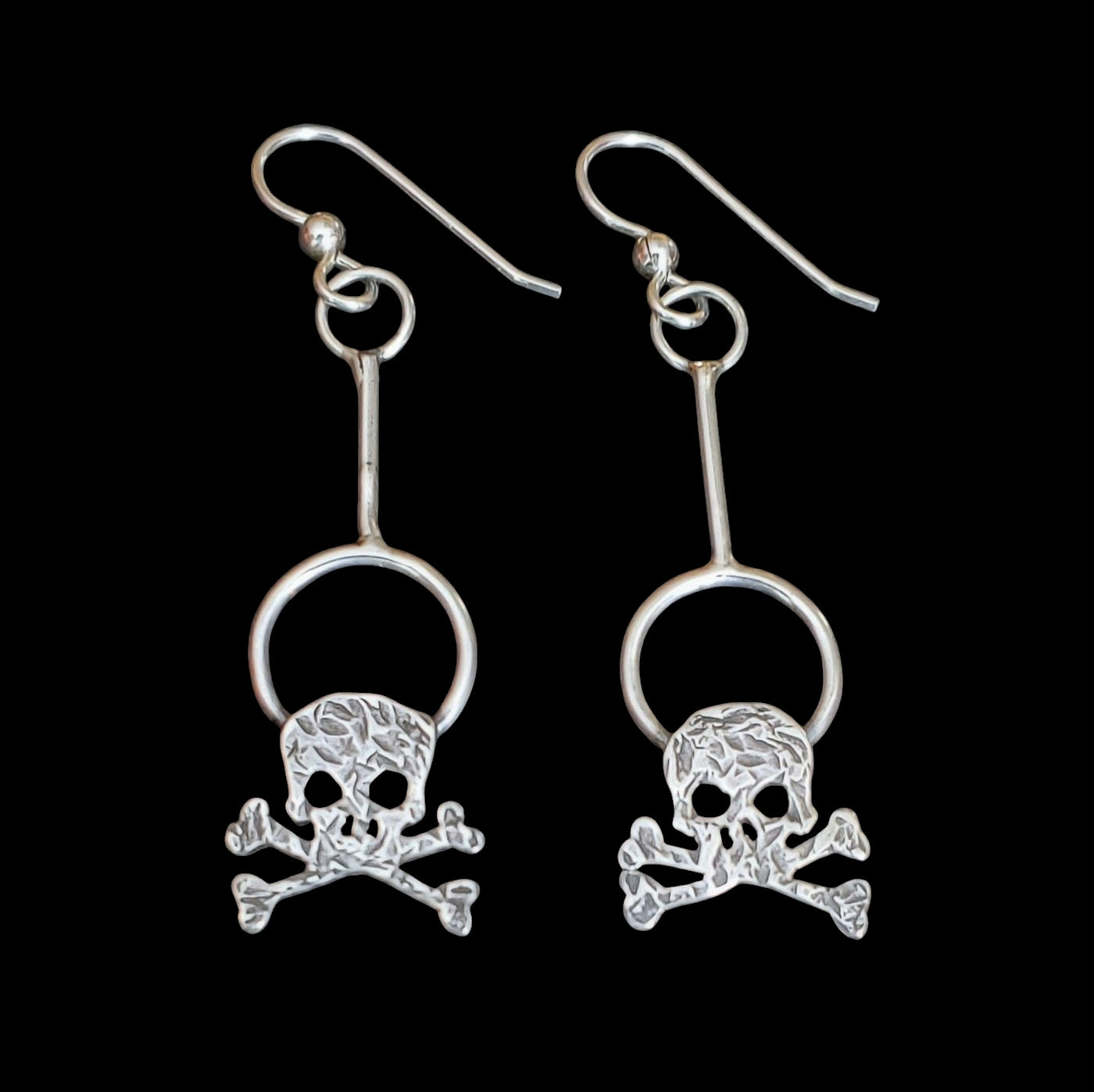 Handmade sterling silver skull drop earrings on circles