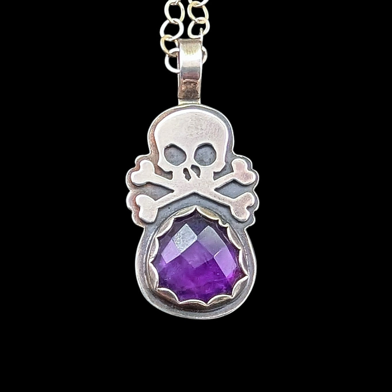 Sterling silver skull necklace with a luscious purple rosecut amethyst