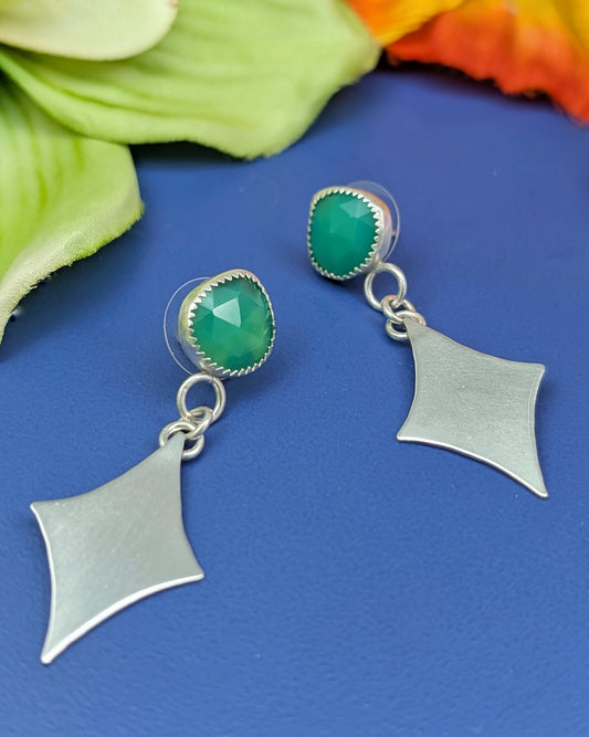 STerling silver retro diamond earrings with green chalcedony stones on blue background