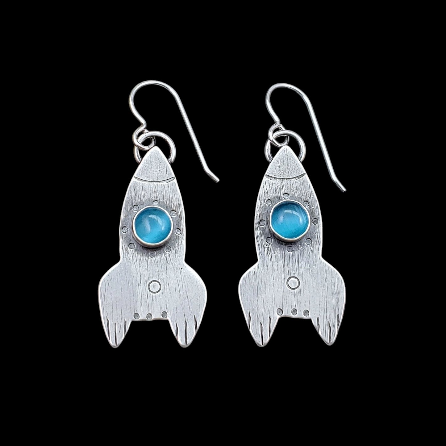 Sterling silver handmade rocket ship earrings with light blue cats eye stone