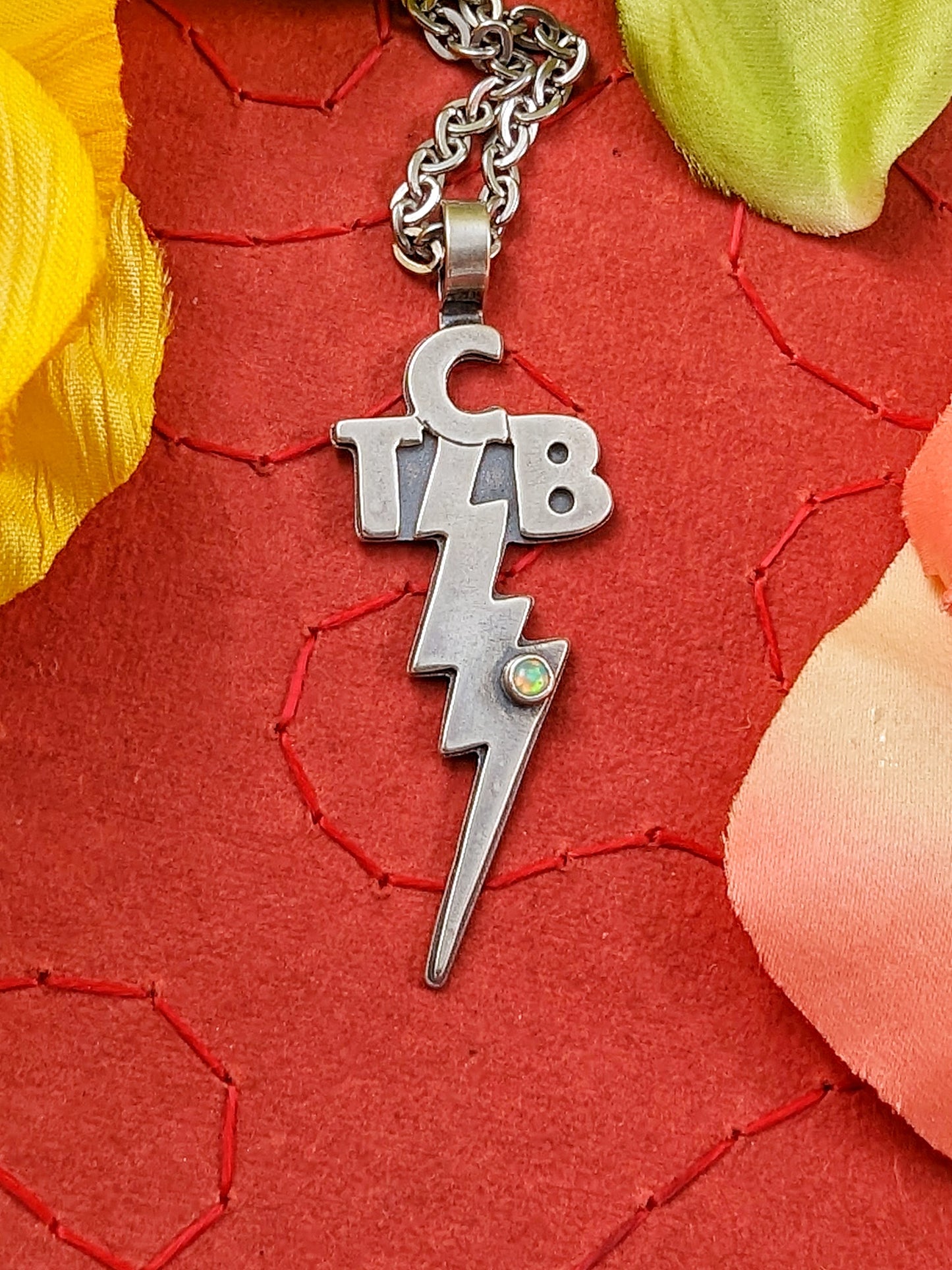 Taking Care of Business TCB necklace