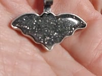 Short video of the sparkle of the midnight quartzite bat pendant
