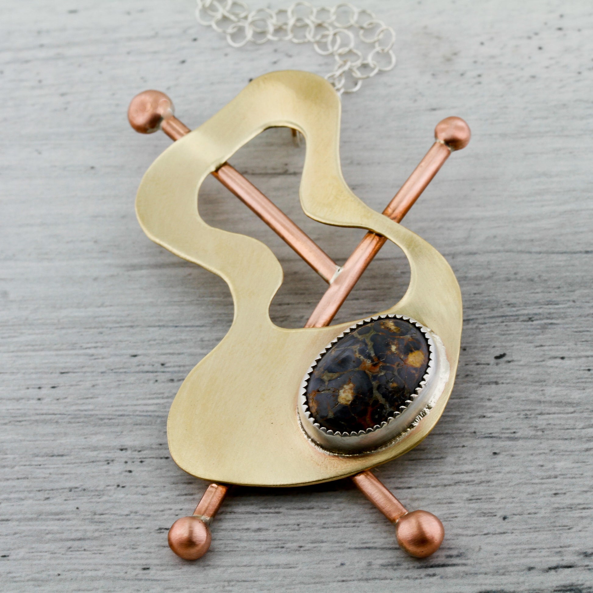 Whimsical abstract brass, copper necklace with leopardskin jasper inspired by modernist jewelery, Frank Rebajes.