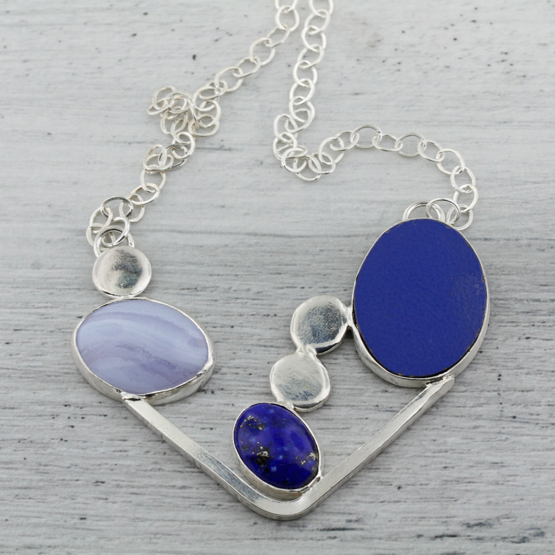 Blue lace agate, lapis lazuli, and laminate on wood modernist abstract necklace.