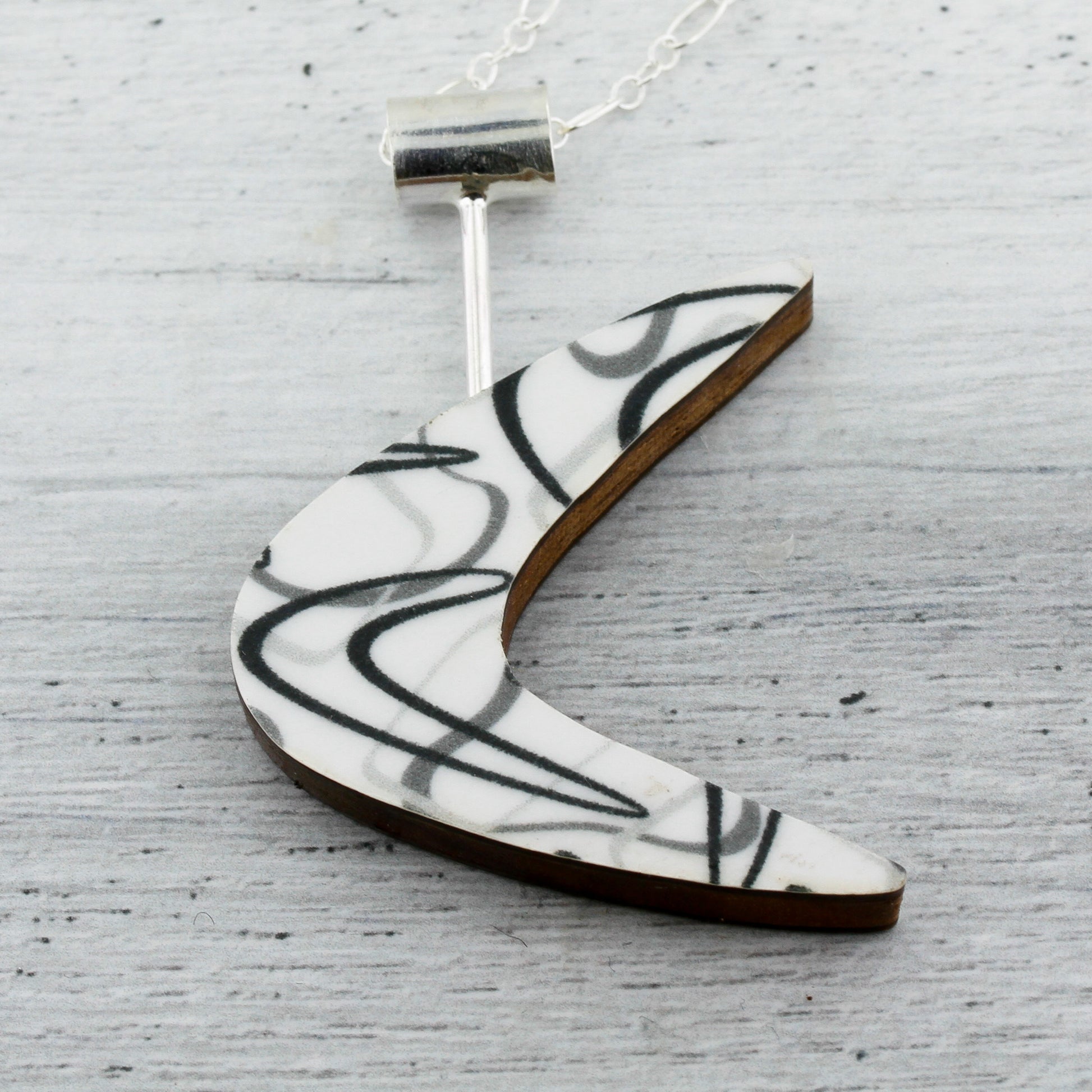 Boomerang laminate on wood mid century modern inspired necklace.