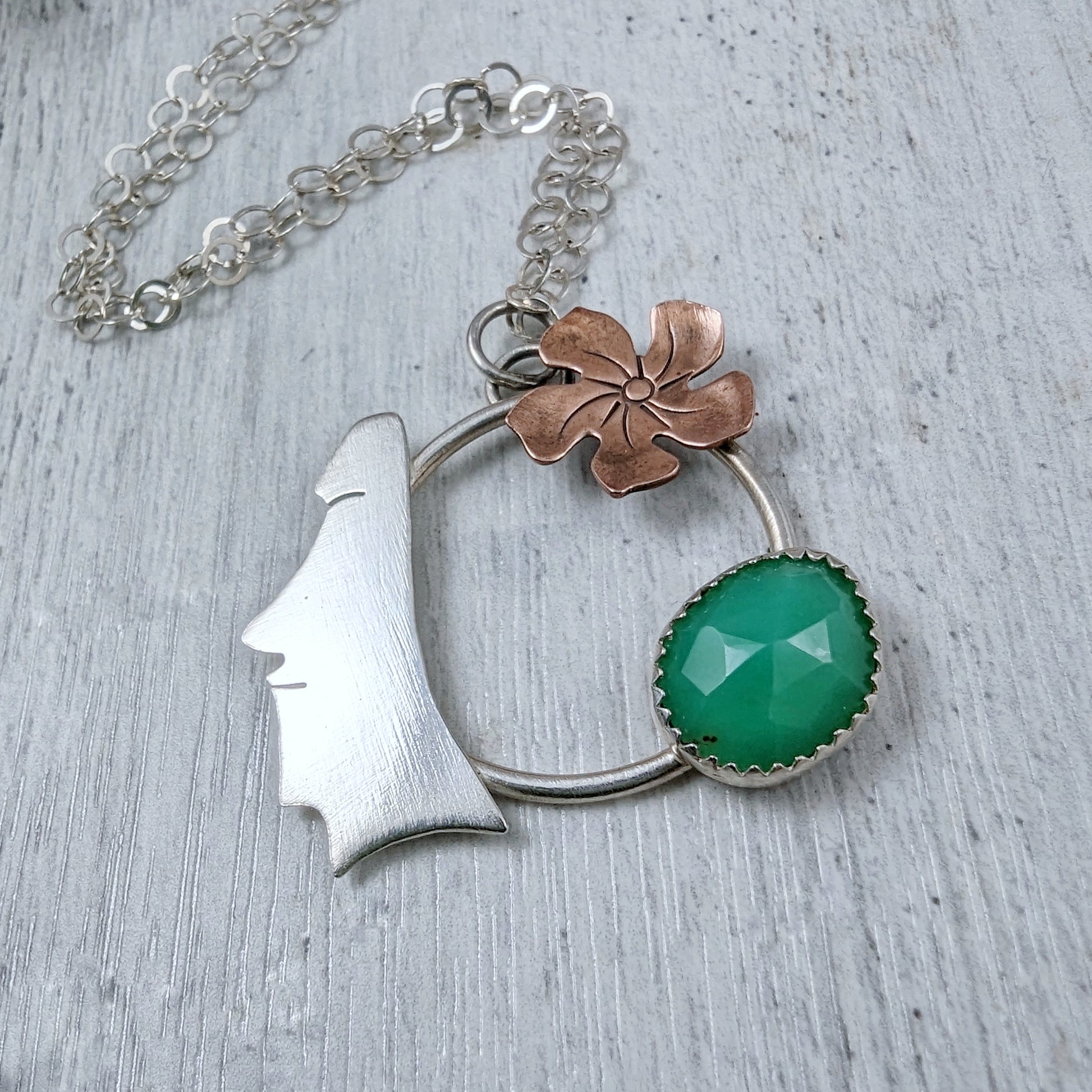 Sterling silver, copper, and chrysoprase necklace on light gray background