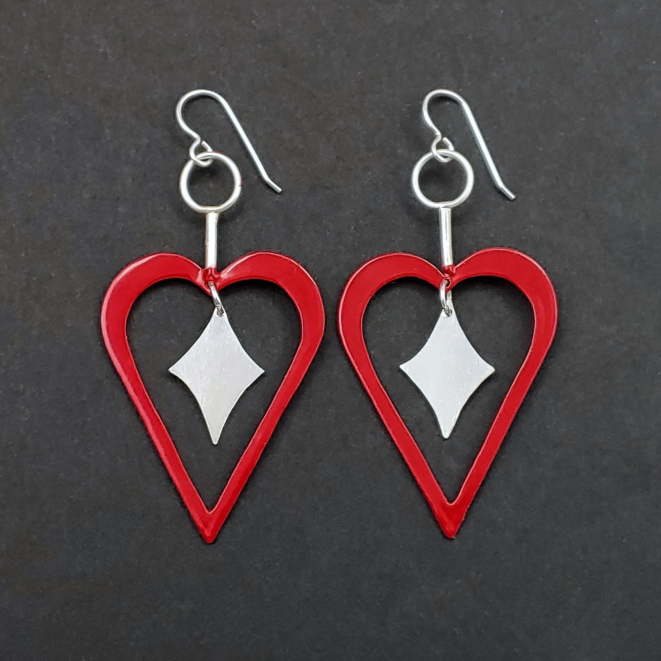 Red heart shaped earrings with sterling silver retro diamonds in the middle