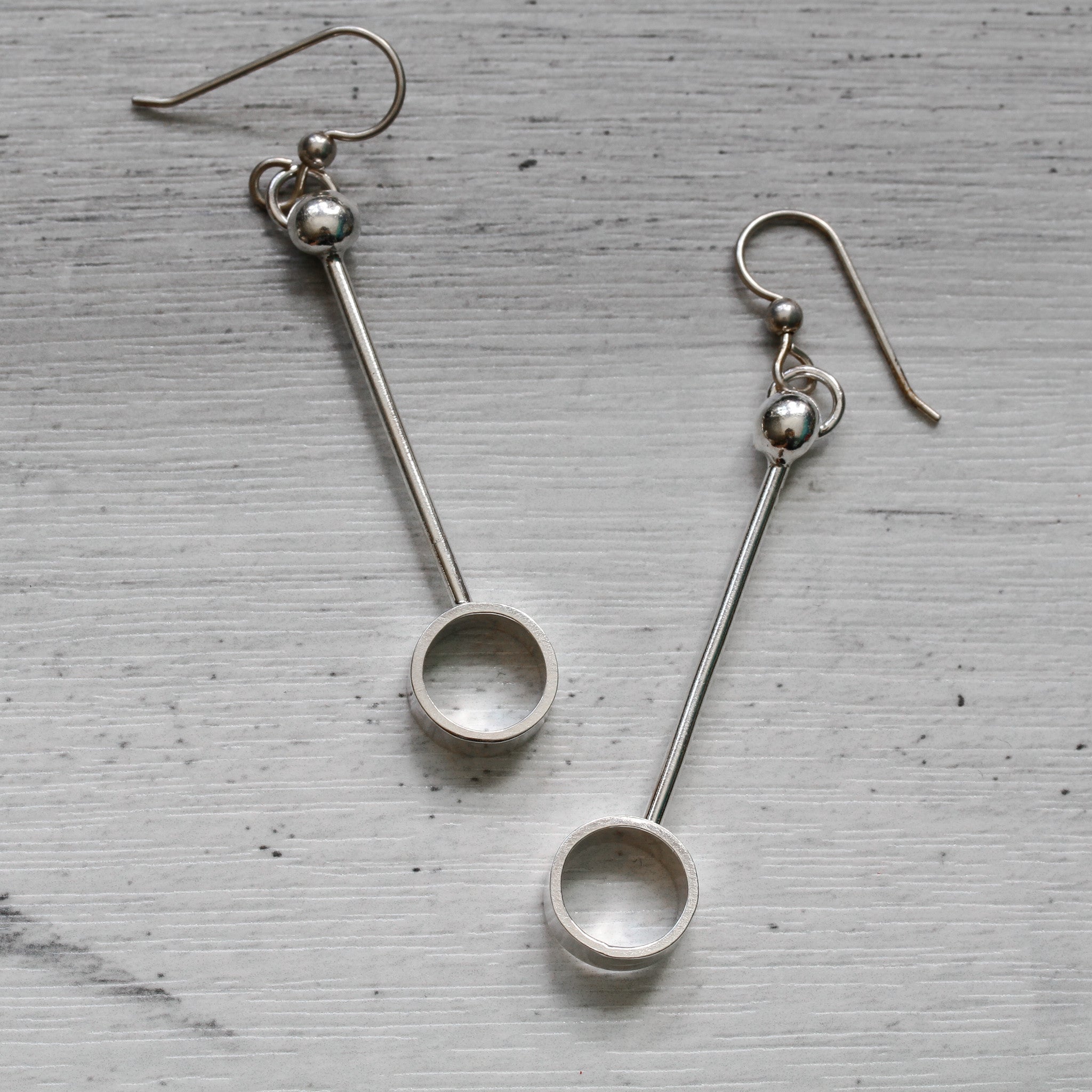 Sterling silver circular order drop earrings