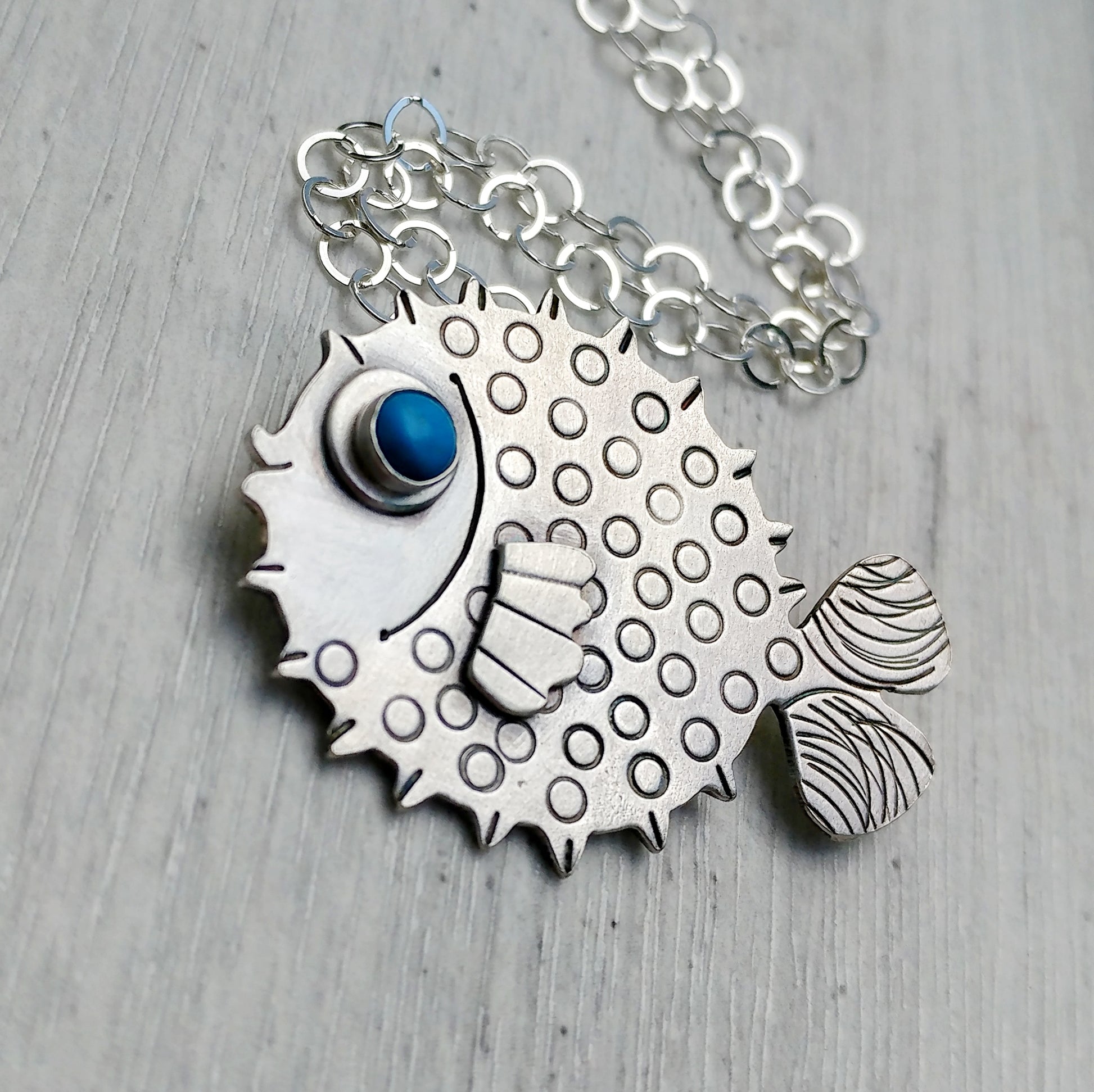 Sterling silver puffer fish necklace.