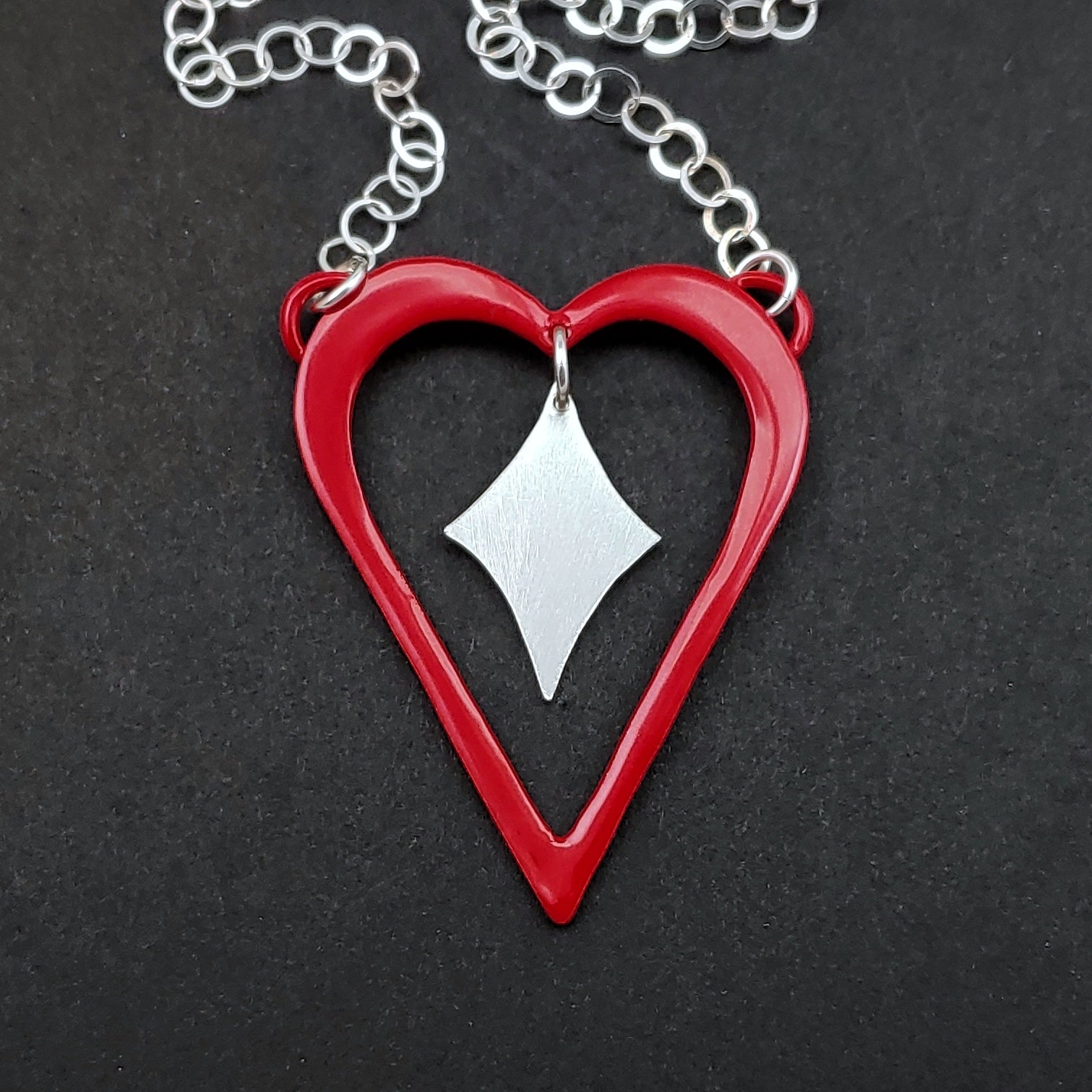 Red powdercoated heart necklace with silver heart