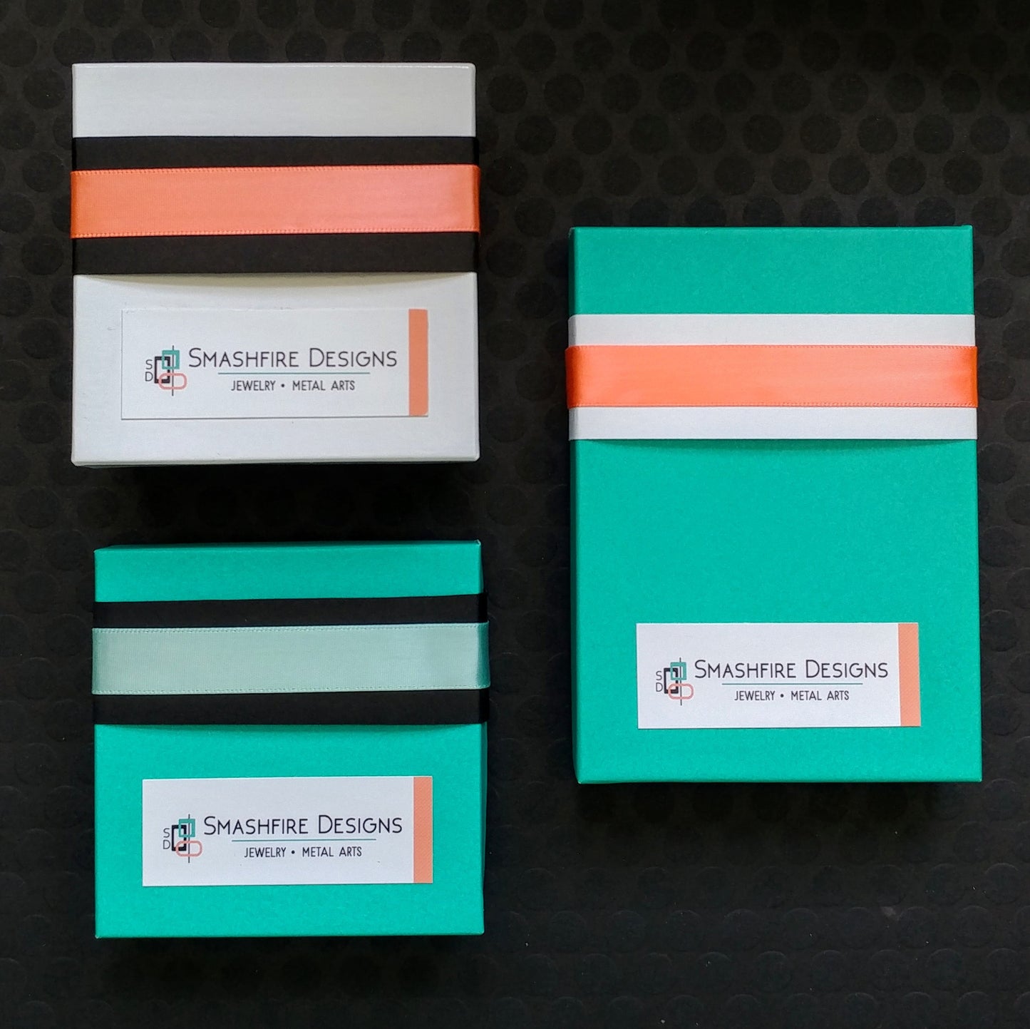 Teal and coral jewelry boxes and labels