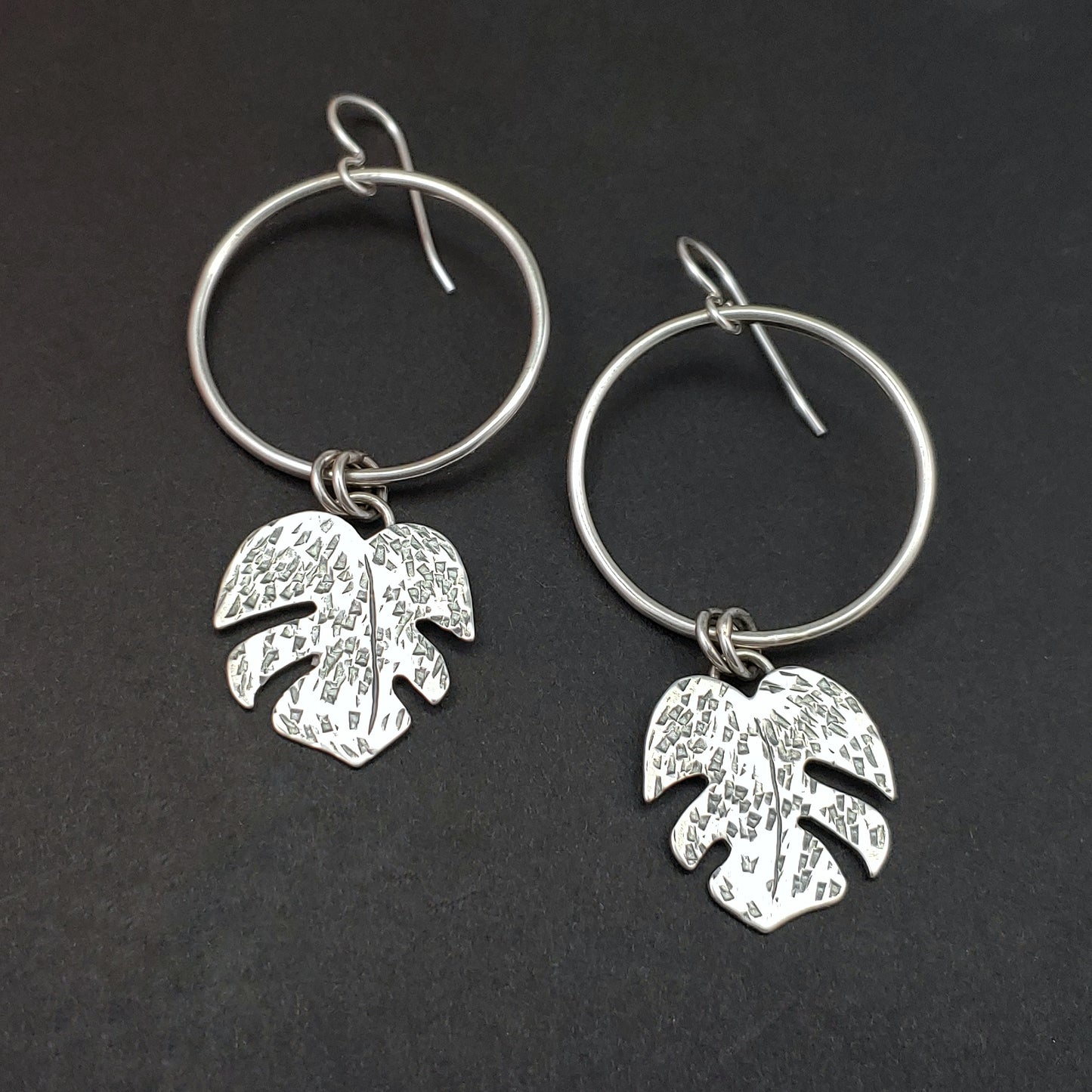 sterling silver monstera leaves dangling from circle hoops