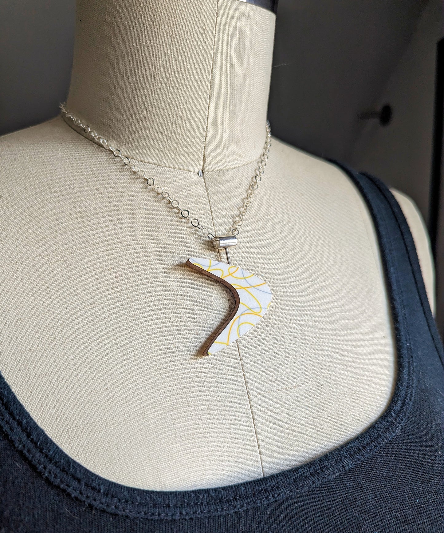 Boomerang Shaped Reversible Laminate Necklace - Yellow/White